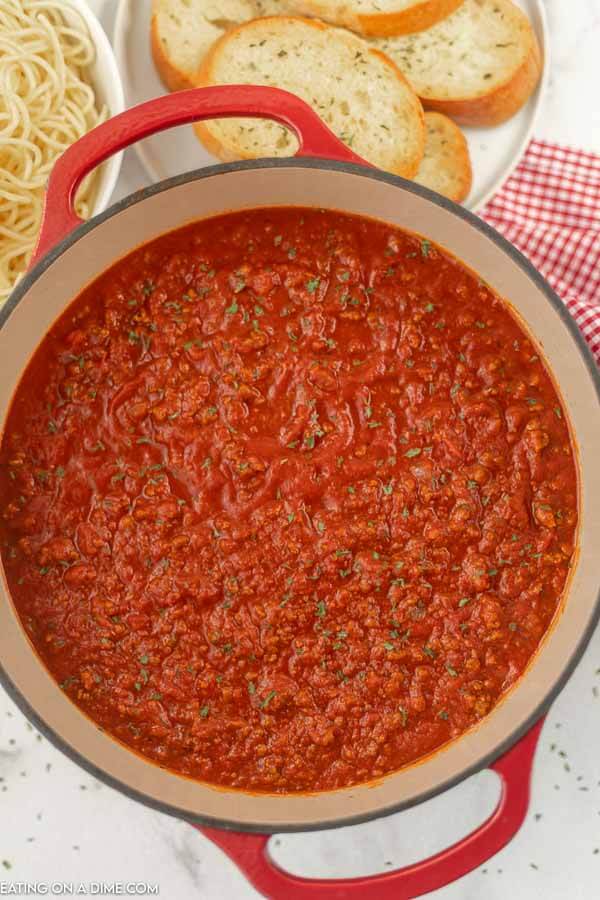 Close up image of spaghetti sauce in a dutch oven.