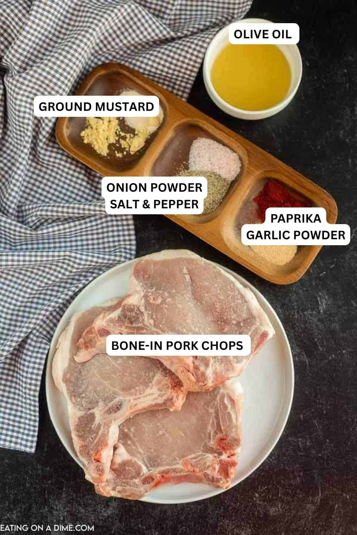 Recipe Ingredients - pork chops, garlic powder, paprika, onion powder, salt & pepper, ground mustard and olive oil.