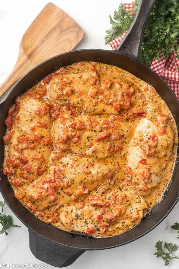 Close up image of roasted red pepper chicken in a skillet