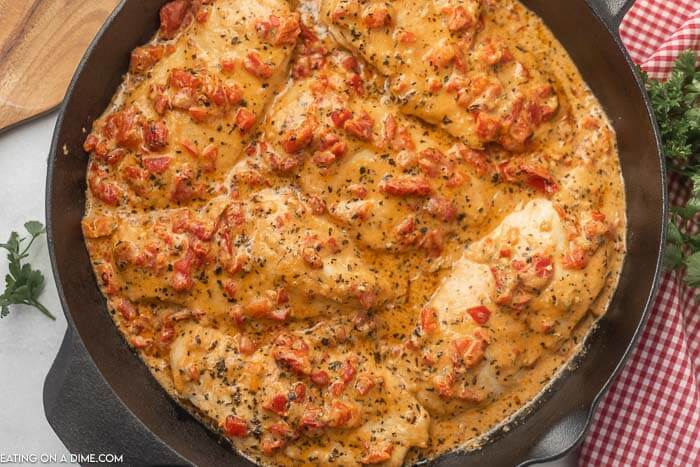 Close up image of roasted red pepper chicken in a skillet 