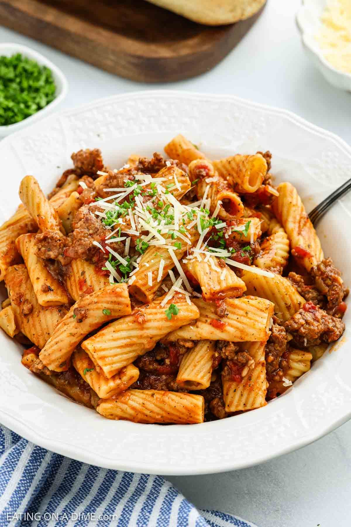 A bowl of pasta with meat and cheese, just like a classic crock pot Italian sausage rigatoni recipe.