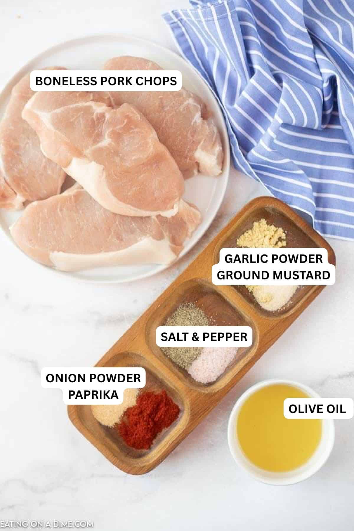 Ingredients for recipe - pork chops, olive oil, garlic powder, ground mustard, salt and pepper, onion powder, paprika. 