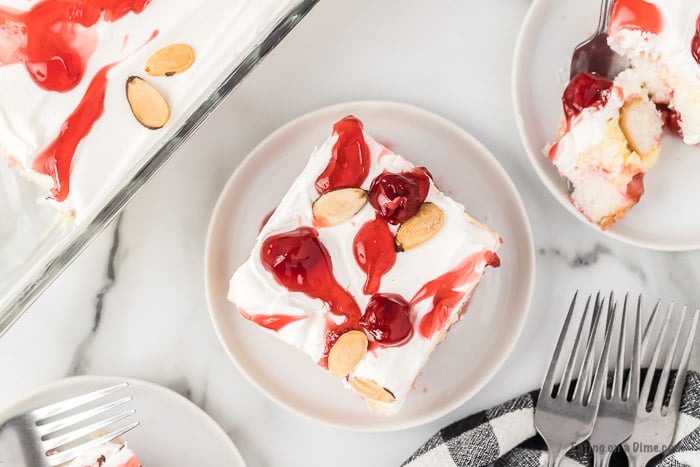 Close up image of a serving of Heaven on Earth cake on a white plate. 