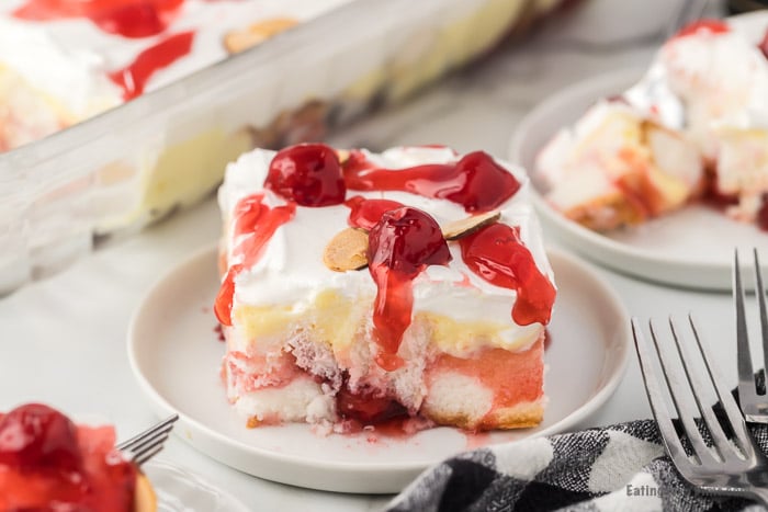 Close up image of a serving on heaven on earth cake on white plate. 