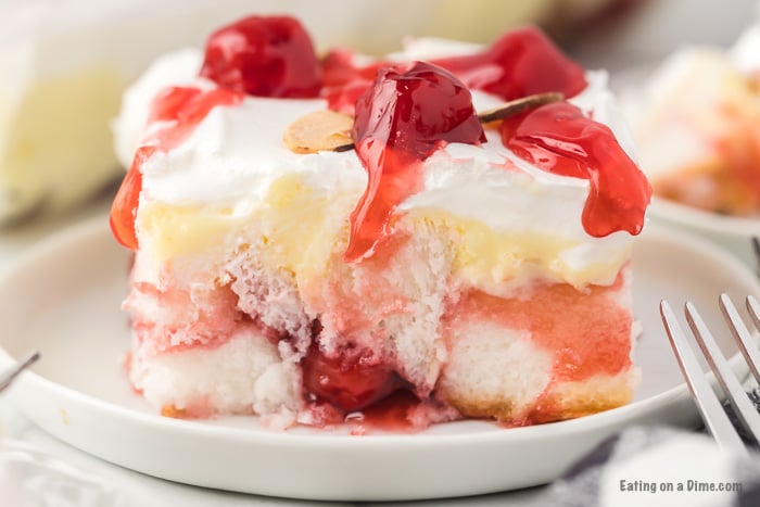 Close up image of a serving on heaven on earth cake on white plate. 