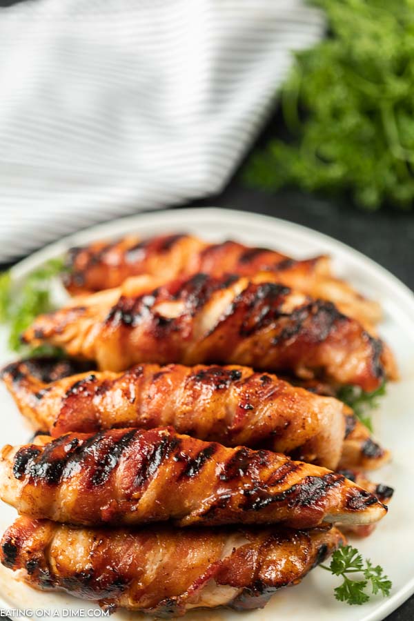 Grilled Bacon Wrapped Chicken Tenders on plate.