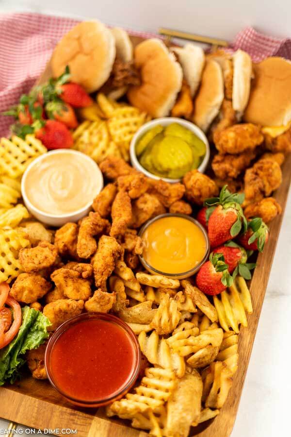 Chick-Fil-A Charcuterie Board - top with dips chicken nuggets, fries, and chicken sandwiches