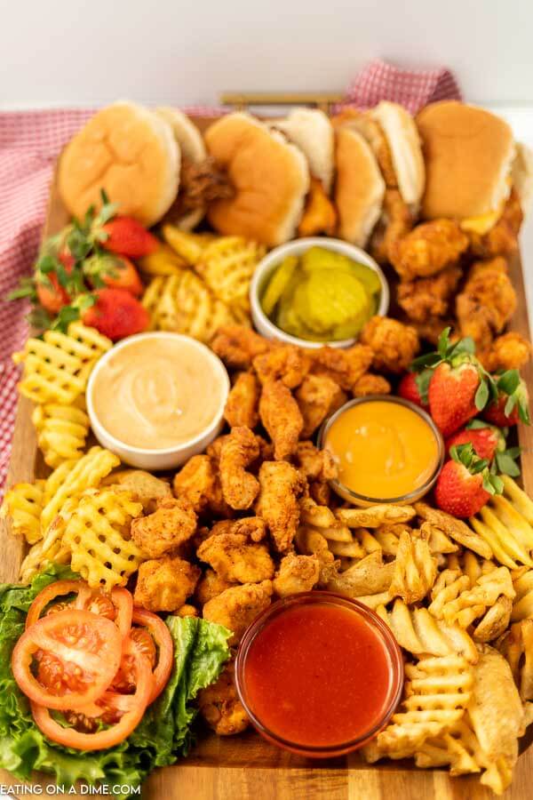 Chick-Fil-A Charcuterie Board - top with dips chicken nuggets, fries, and chicken sandwiches