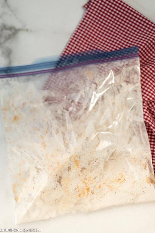 Ziplock bag with flour mixture and chicken. 