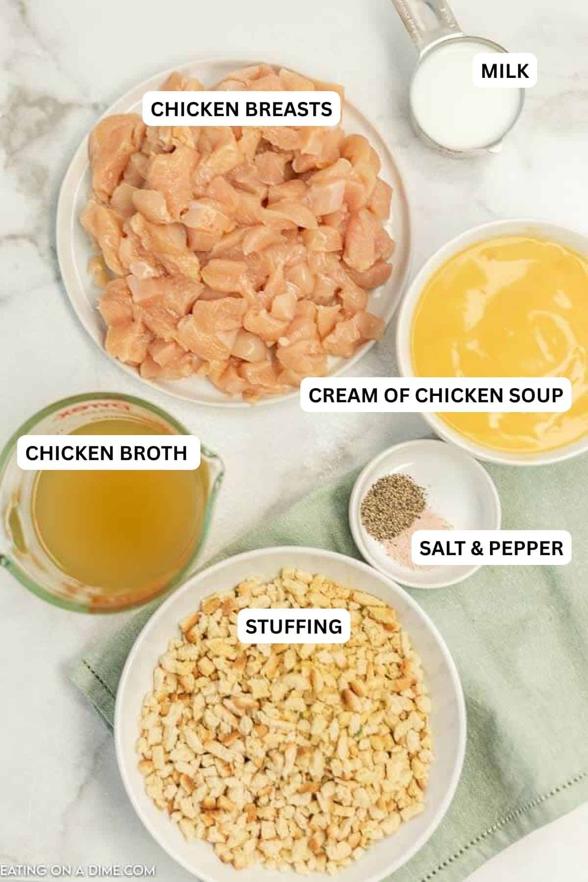Ingredients for recipe - chicken, cream of chicken soup, chicken broth, salt and pepper, stuffing and milk.