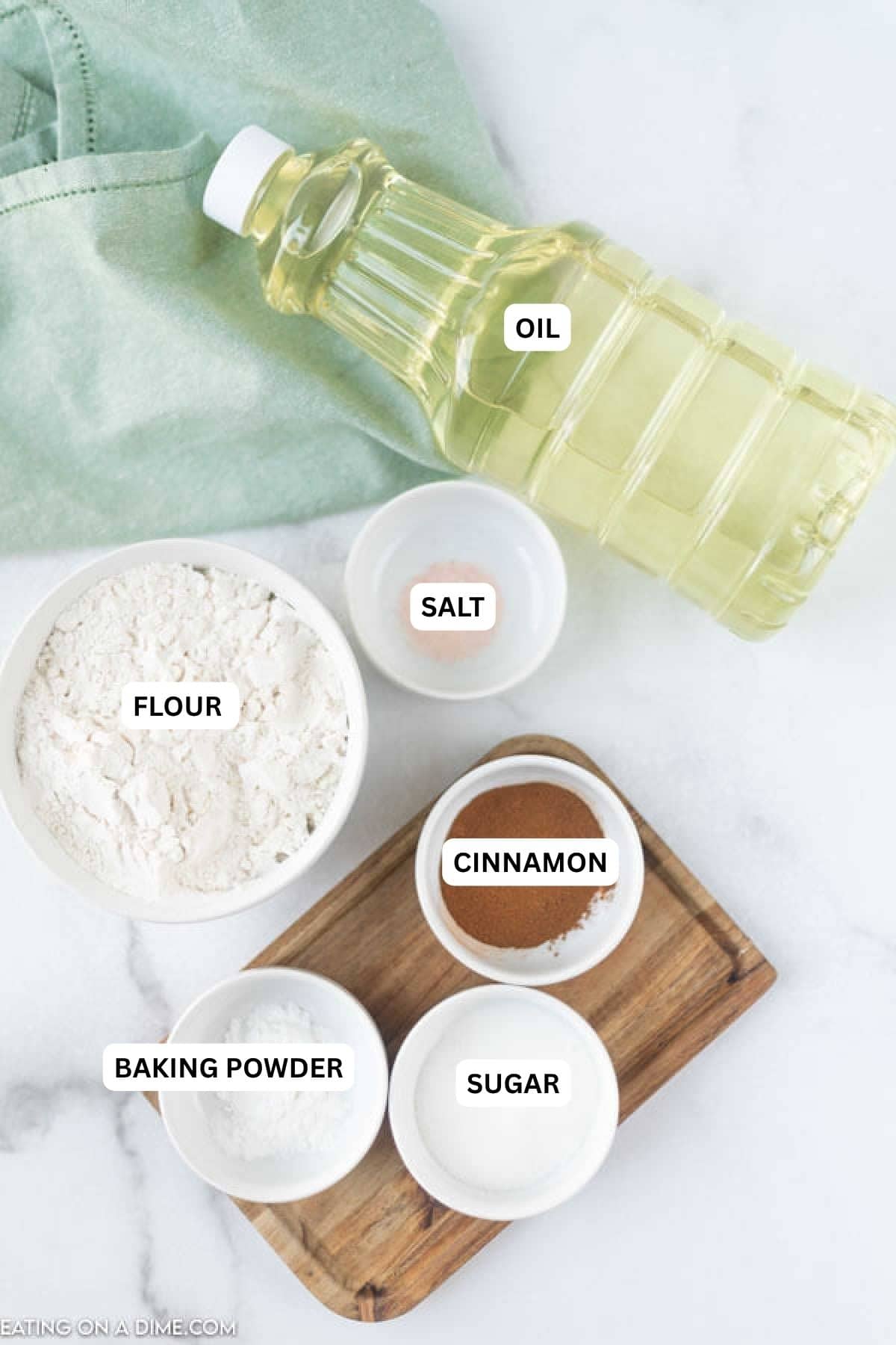 Ingredients for recipe: oil, salt, flour, cinnamon, baking powder and sugar.