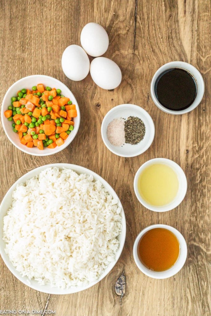 Ingredients sesame oil, vegetable oil, cooked rice, soy sauce, salt and pepper, frozen vegetables eggs