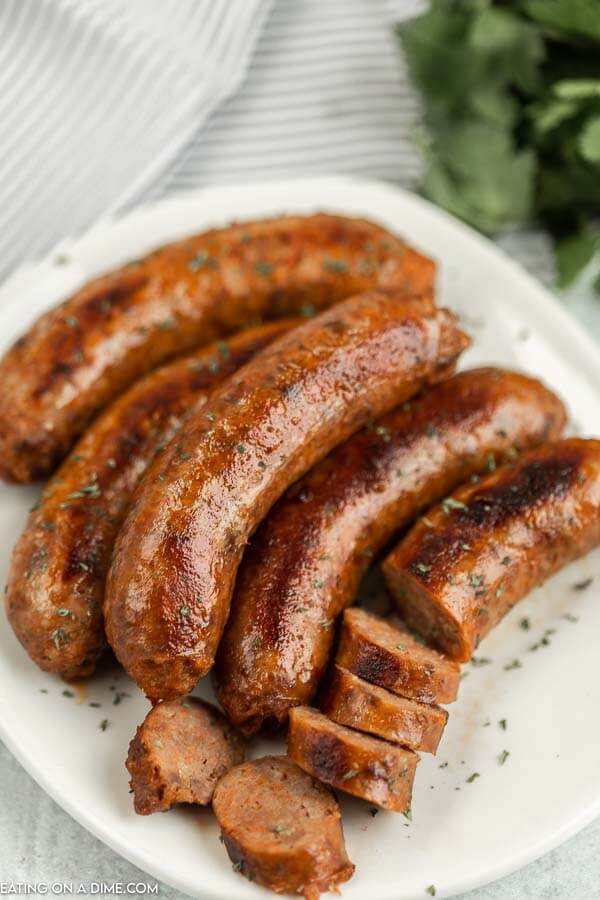Close up image of italian sausage on a white plate. 