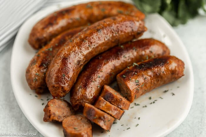 Close up image of italian sausage on a white plate. 