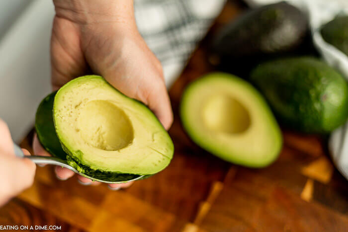 The process of removing the avocado from the skin with a spoon. 