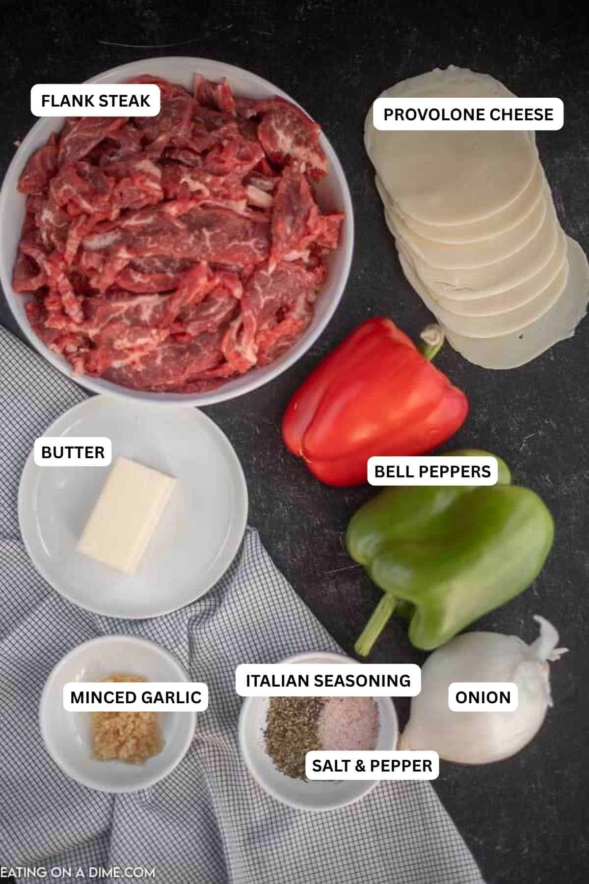 Keto Philly Cheese Steak Skillet dinner is loaded with tender beef, onion and bell peppers. Low carb philly cheese steak recipe is so easy. Try this today! Ingredients for recipe: flank steak, minced garlic, green bell pepper, butter, red bell pepper, onion, provolone cheese, Italian seasoning, salt and pepper.