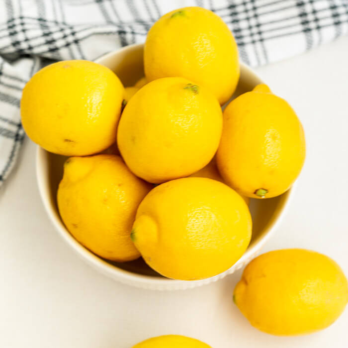 Close up image of a bowl of lemons