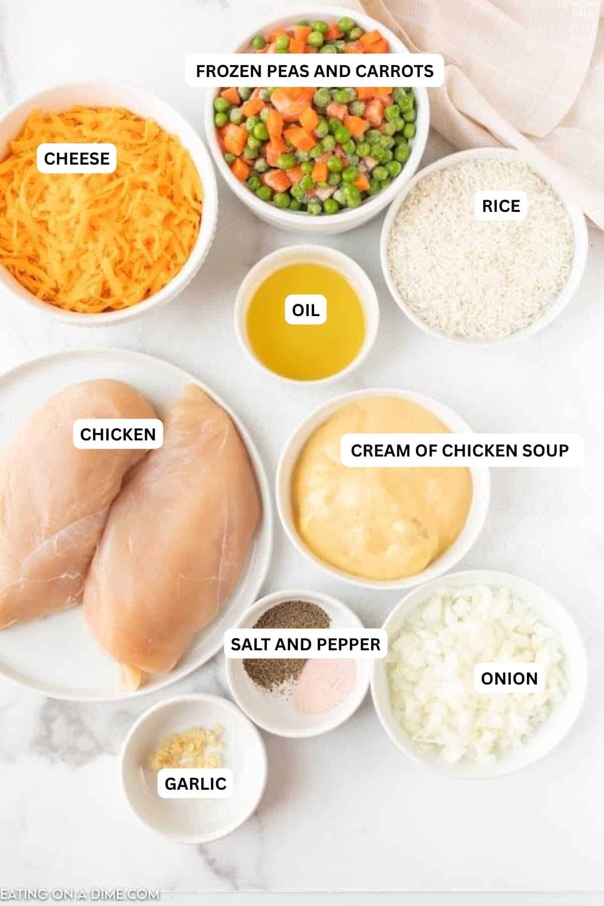 Ingredients for recipe: salt, pepper, onion, garlic, oil, cheese, rice, chicken, peas and carrots.