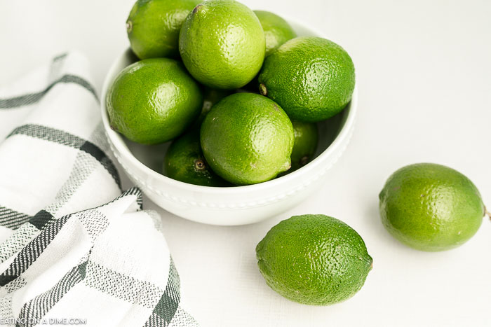 close up image of a bowl of whole limes