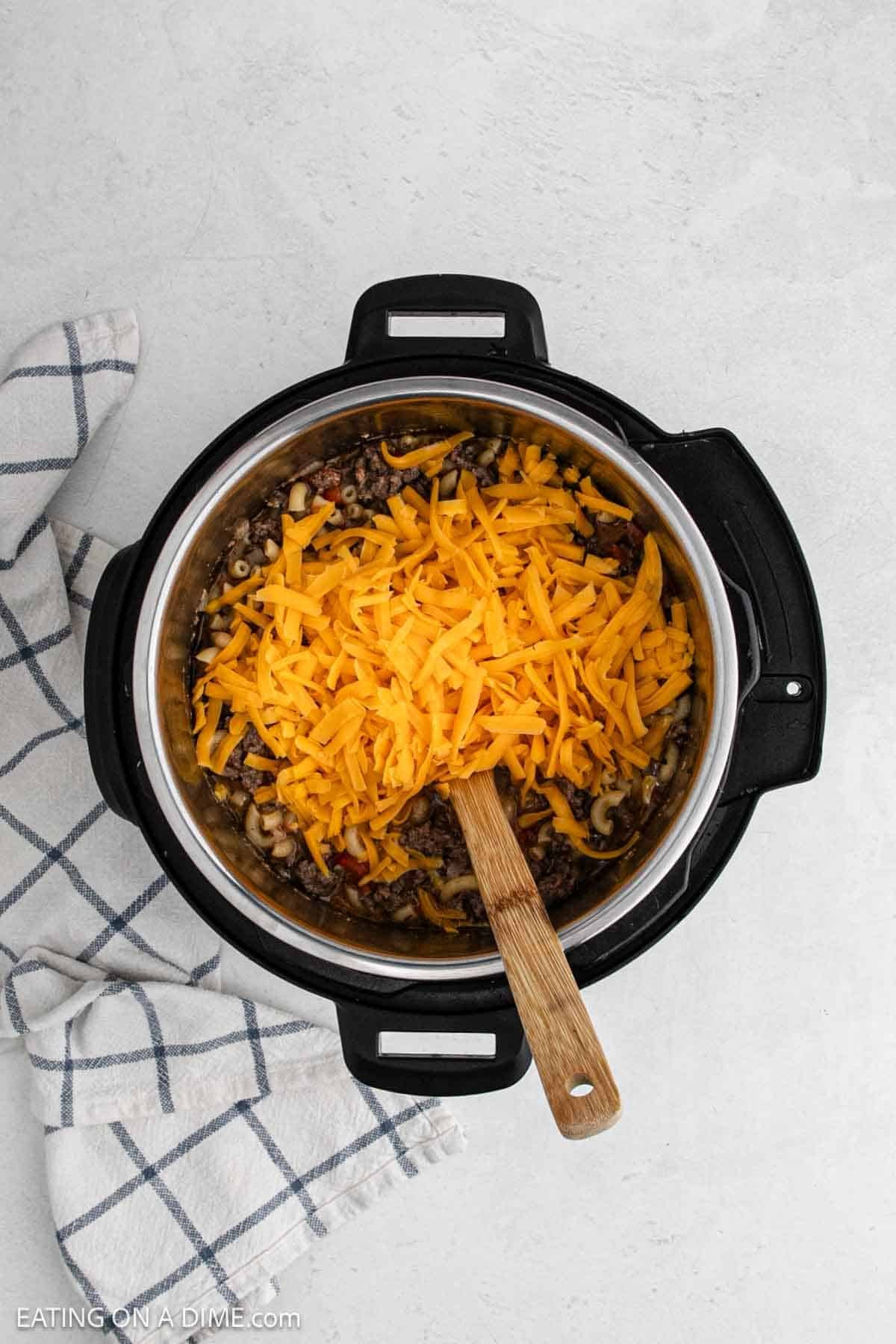 Shredded cheese topped the cooked recipe in the instant pot.