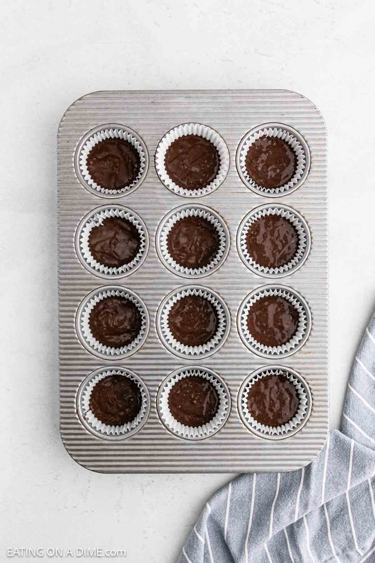 Cupcake batter divided into cupcake pan