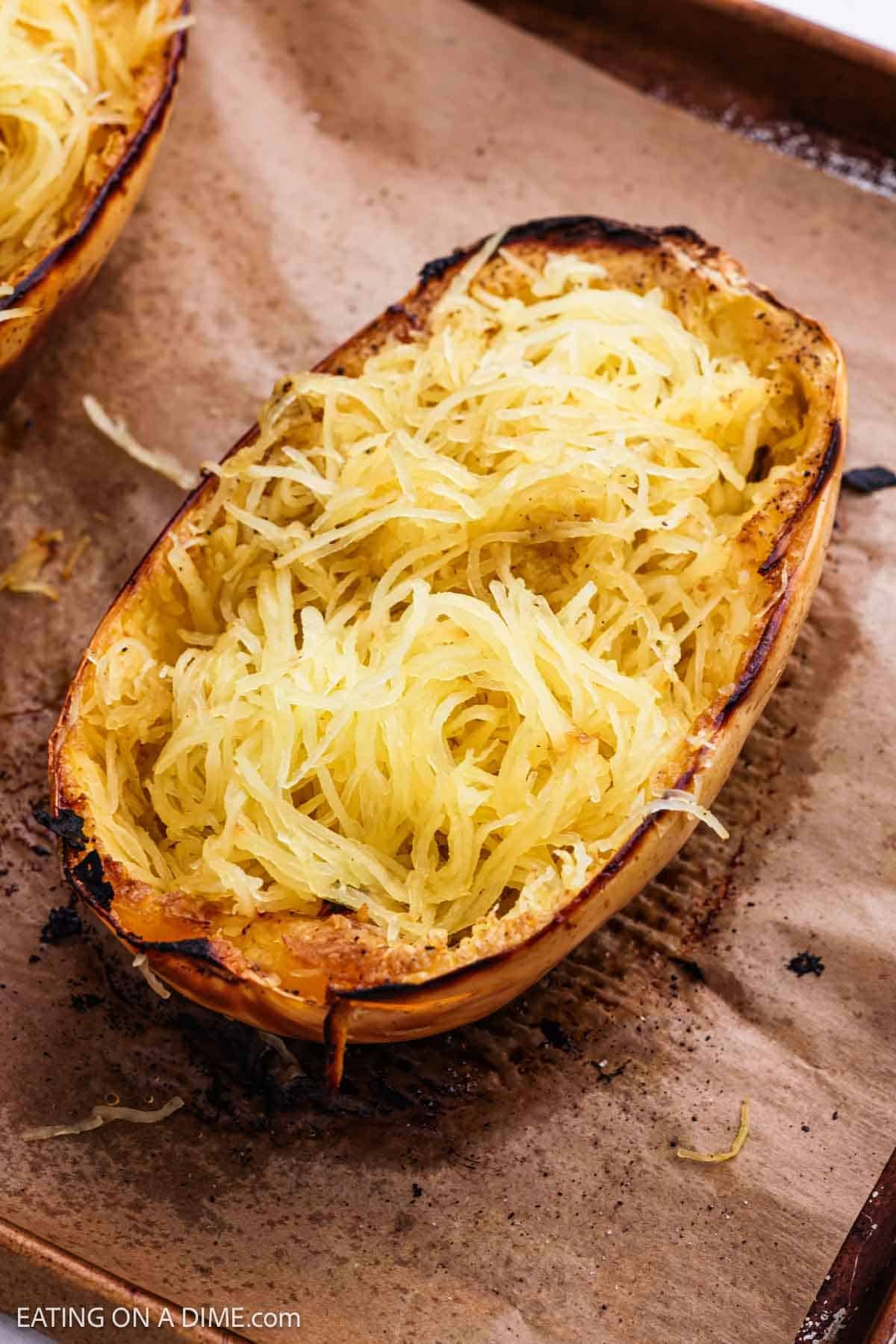 Squash shredded into strands on a baking sheet.