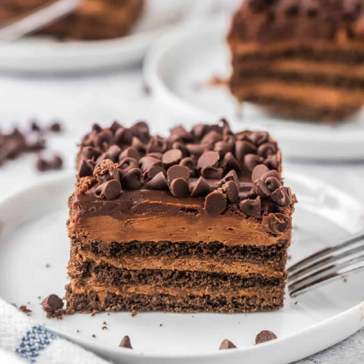 Piece of chocolate icebox cake on a white plate.