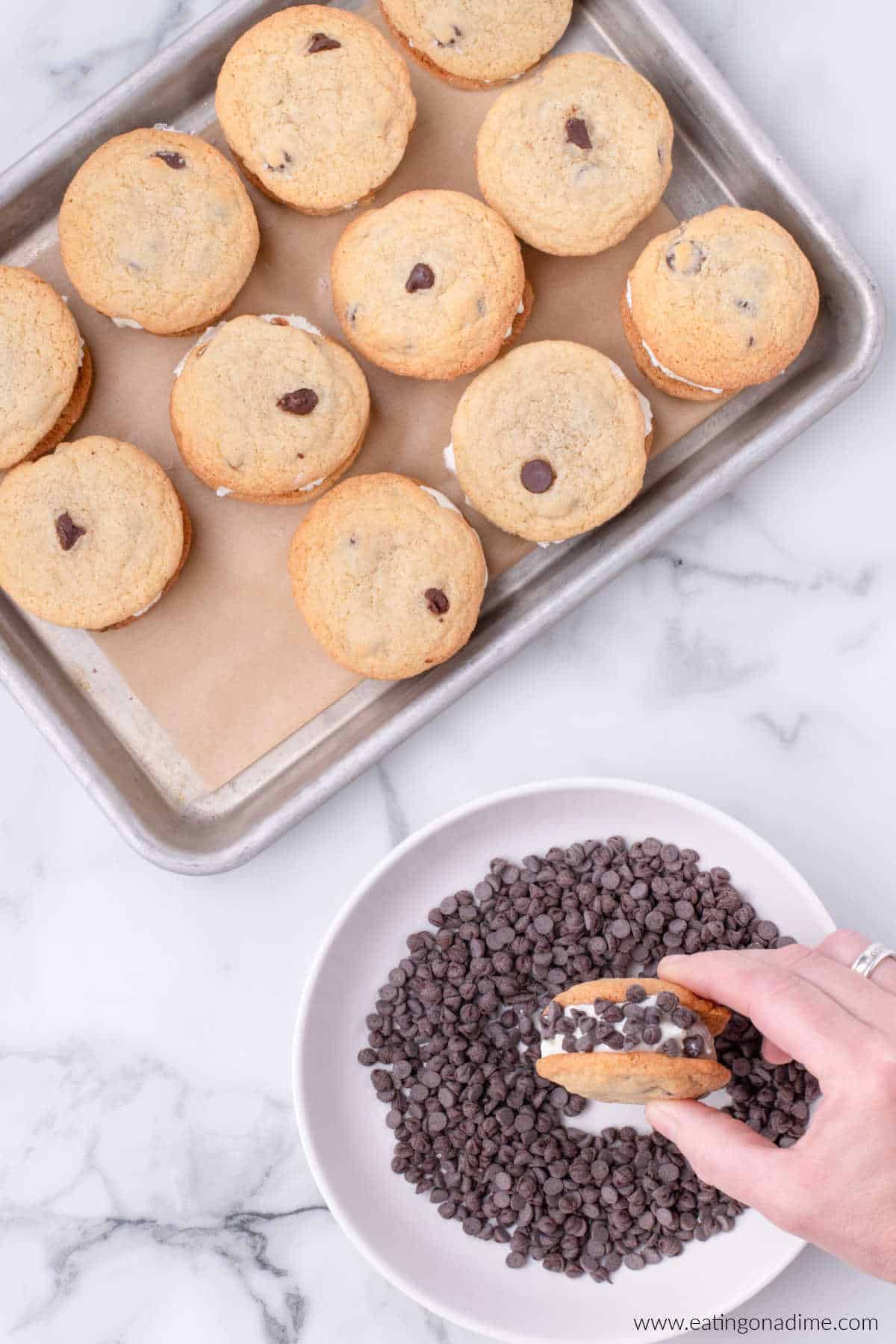 Rolling the ice cream sandwiches in a bowl of chocolate chips.