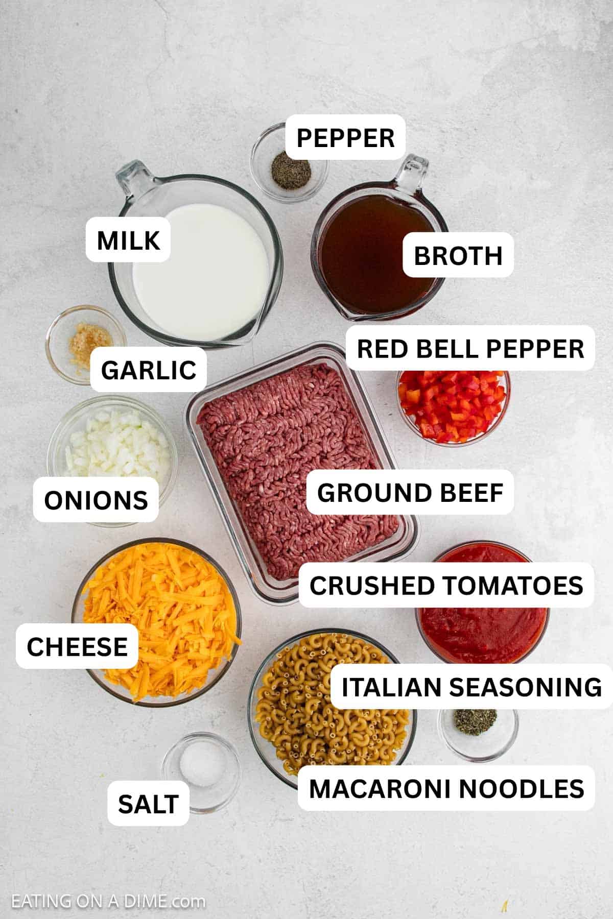 Ingredients needed to make this recipe includes ground beef, onion, garlic, milk, broth, bell pepper, spices, tomatoes, pasta, and cheese.