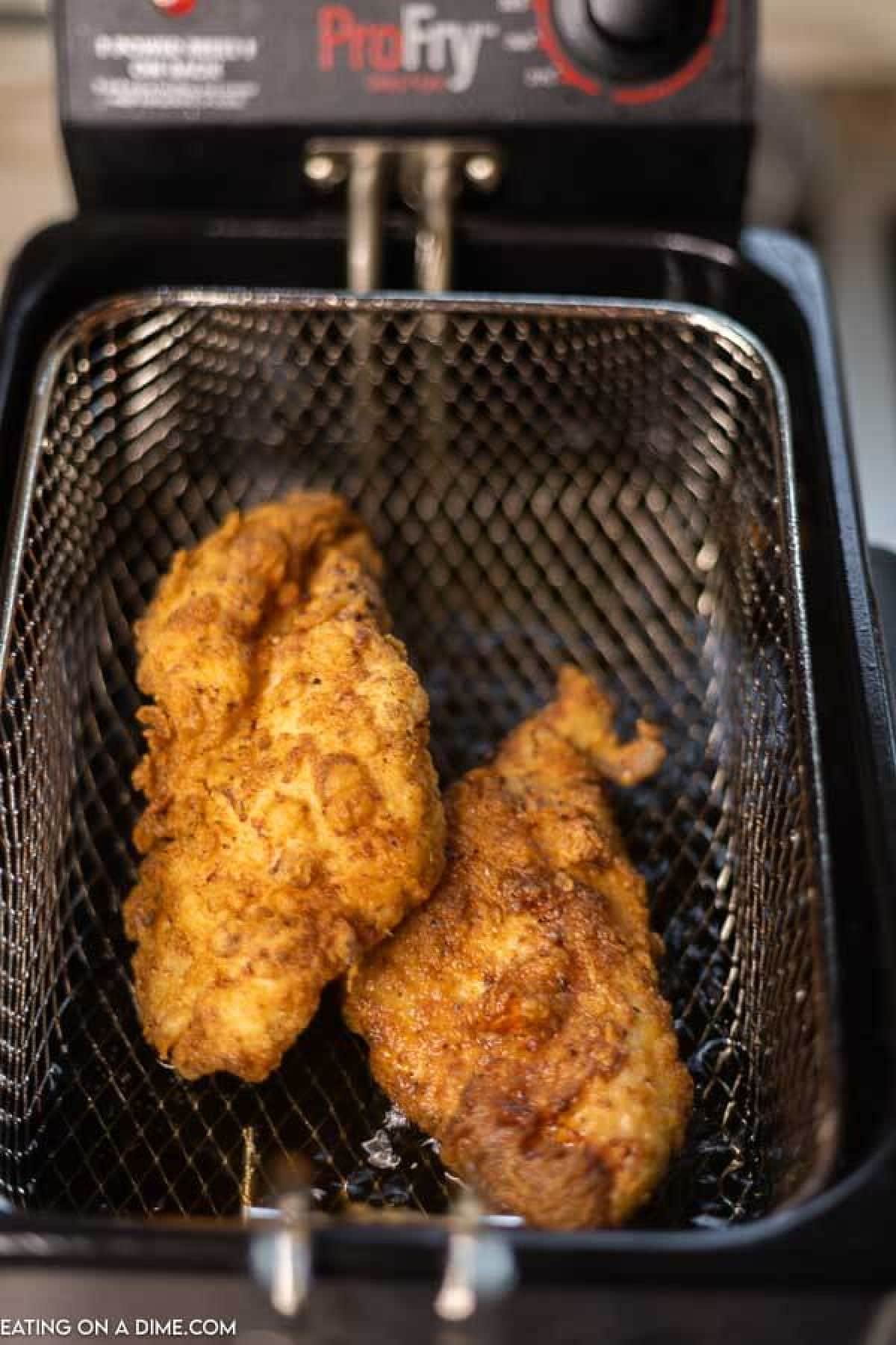 Chicken in fryer. 
