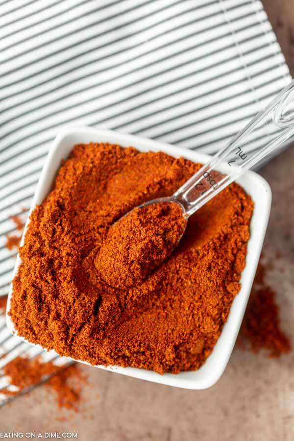 Close up image of Chili Powder in a white dish. 