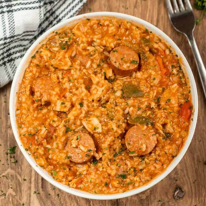 Close up image of chicken jambalaya in a white bowl 