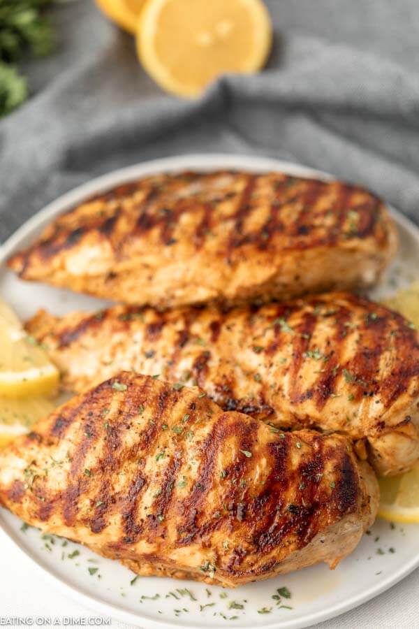 Grilled chicken on a plate ready to enjoy. 