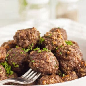 Meatballs stacked in a bowl.