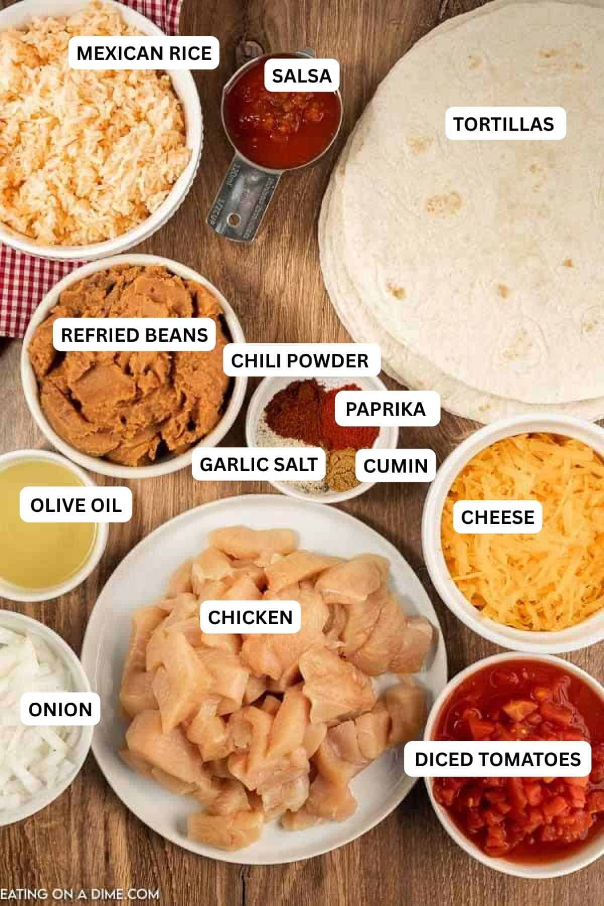 Ingredients for recipe: diced tomatoes, onion, chicken, cheese, olive oil, cumin, garlic salt, paprika, chili powder and refried beans.