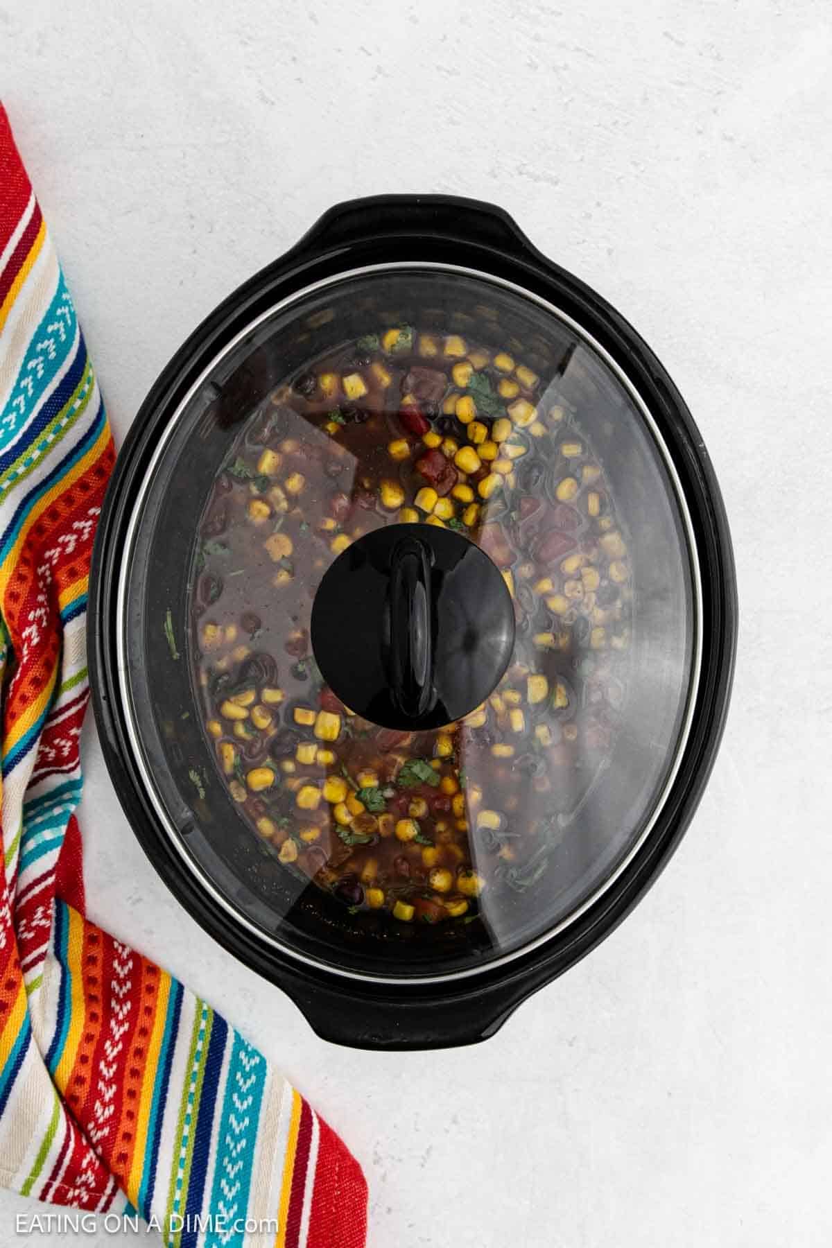All ingredients combined into the slow cooker and topped with lid