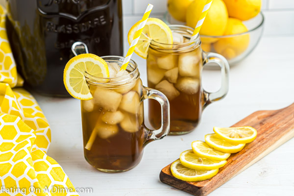 Close up image of sun tea in two glass with slices of lemon. 