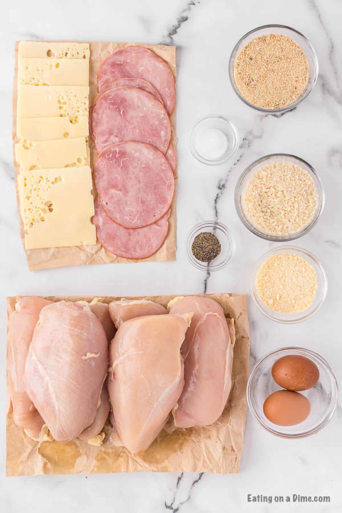 Ingredients needed for recipe: chicken breasts, slice of ham, swiss cheese, salt and pepper, bread crumbs, panko bread crumbs, parmesan cheese, eggs.