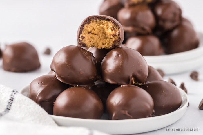 Chocolate Peanut Butter Balls with Rice Krispies stacked on a plate