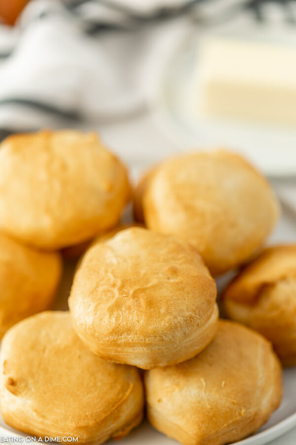 Air fryer biscuits on a white plate. 
