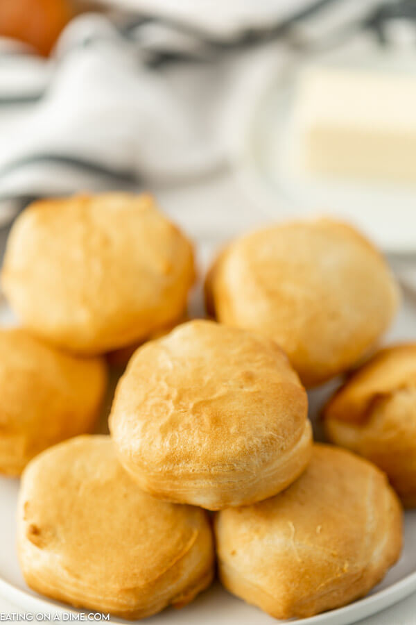 Air fryer biscuits on a white plate. 