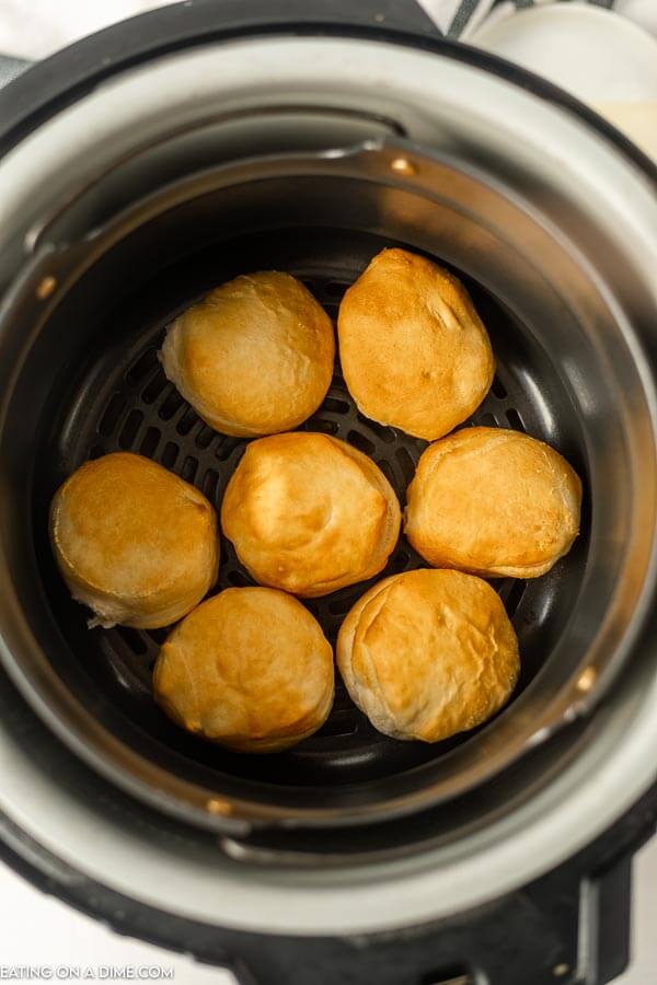 Close up image of biscuits in the air fryer.
