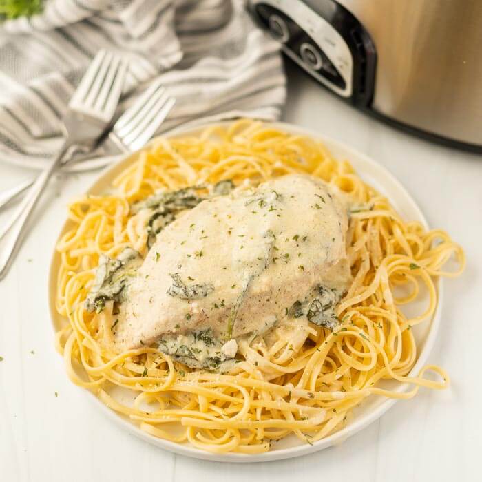 Crock pot creamy parmesan chicken over pasta. 