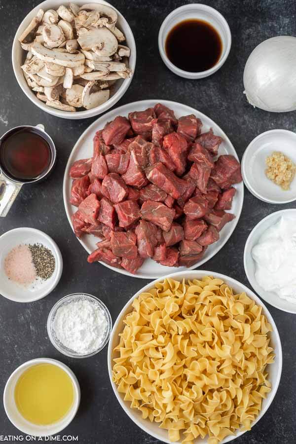Ingredients needed - stew meat, olive oil, minced garlic, onion, sliced mushrooms, Worcestershire sauce, salt and pepper, red wine, beef broth, egg noodles, cornstarch sour cream.