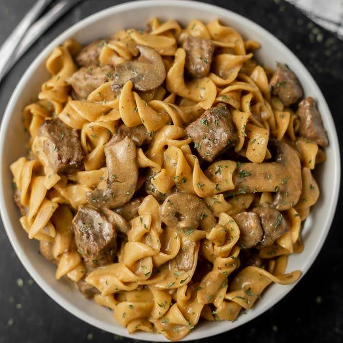 Close up image of beef stroganoff in the white bowl. 
