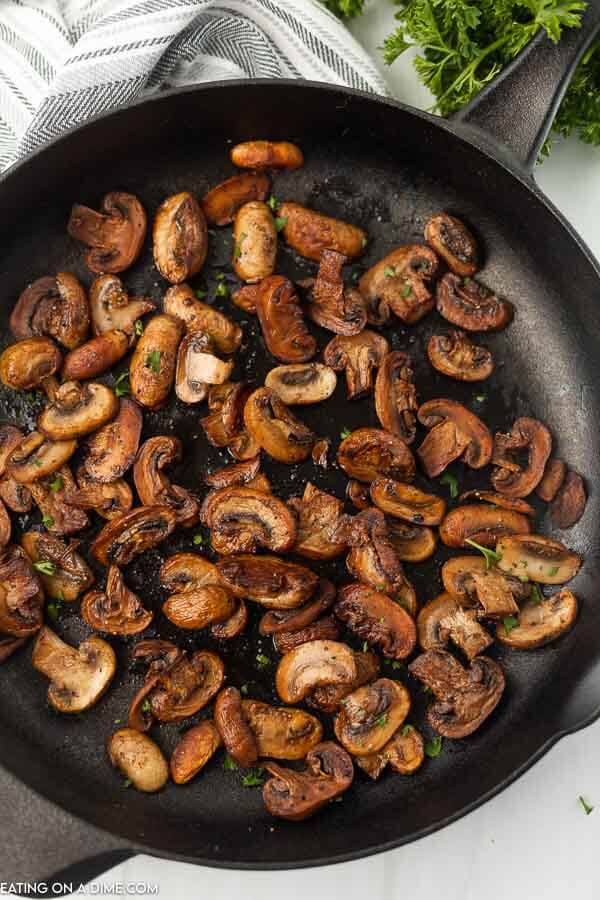 Sauteed mushrooms in a skillet. 