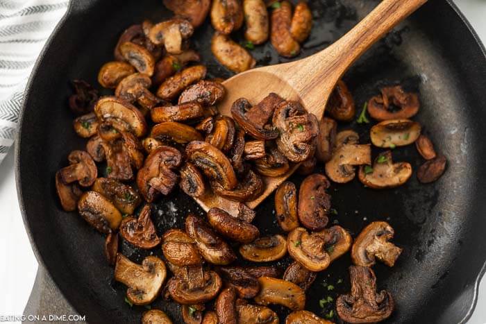 Sauteed mushrooms in a skillet. 