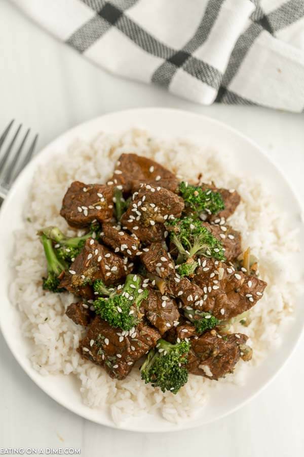 Close up image of beef and broccoli over rice