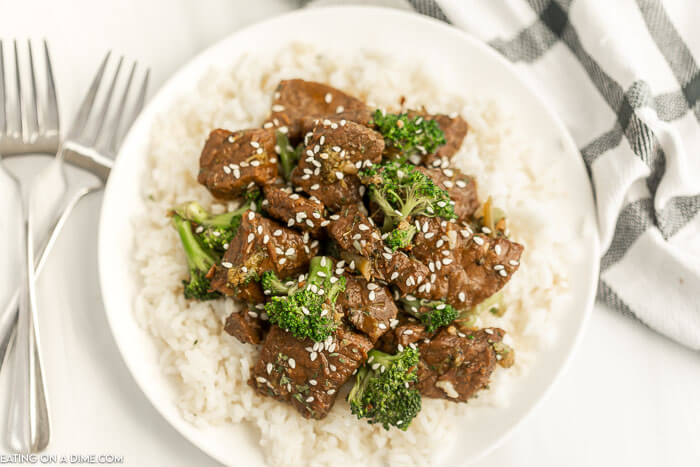 Close up image of beef and broccoli over rice