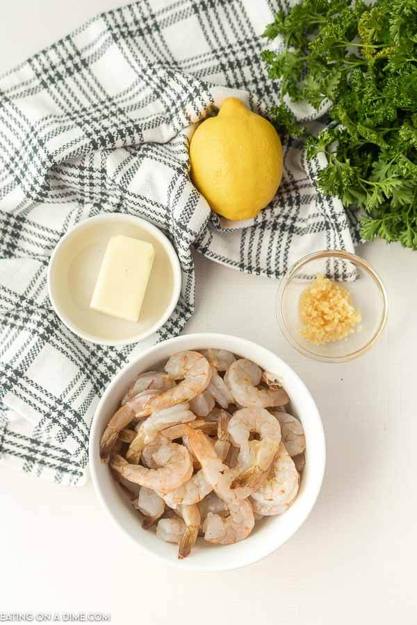 Ingredients for shrimp packet recipe - shrimp, parsley, butter, lemon, garlic
